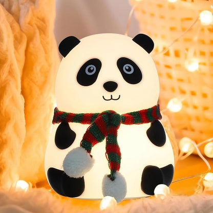 Panda-shaped night light with a red and green scarf with warm light